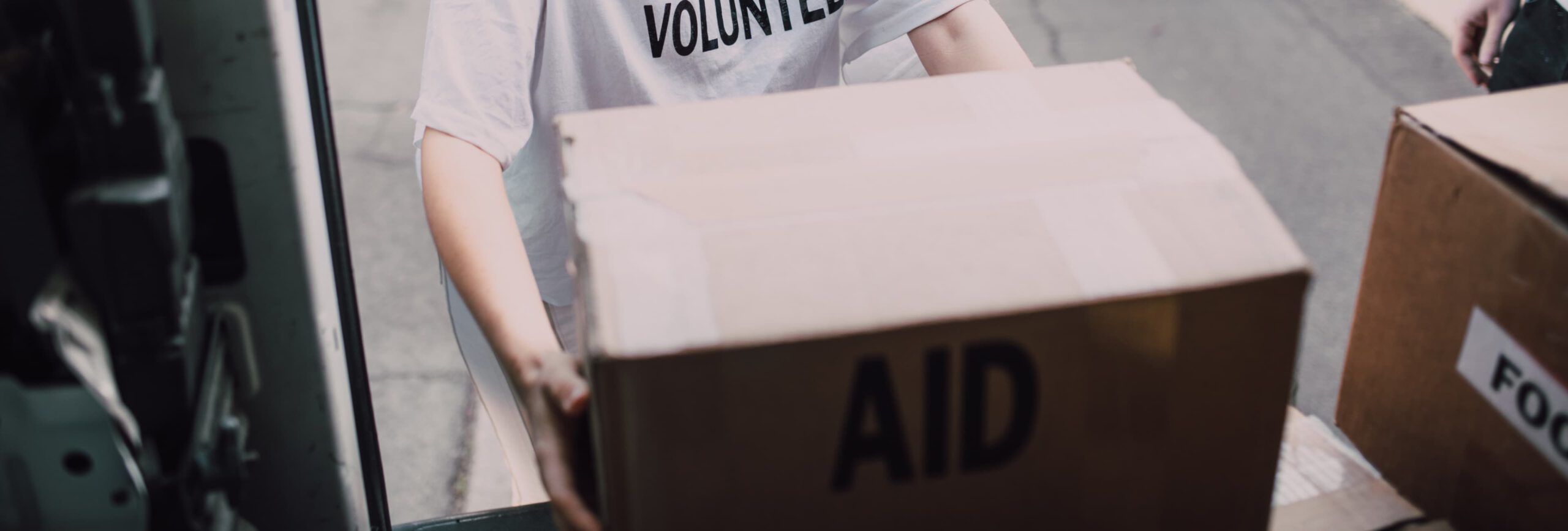 marian's closet volunteer carrying a box